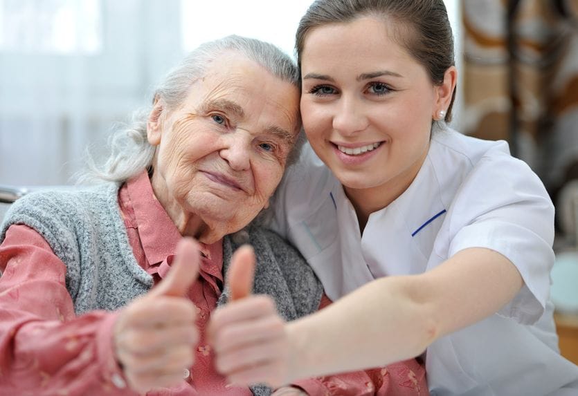 18916077 - senior woman and female nurse are showing thumbs up